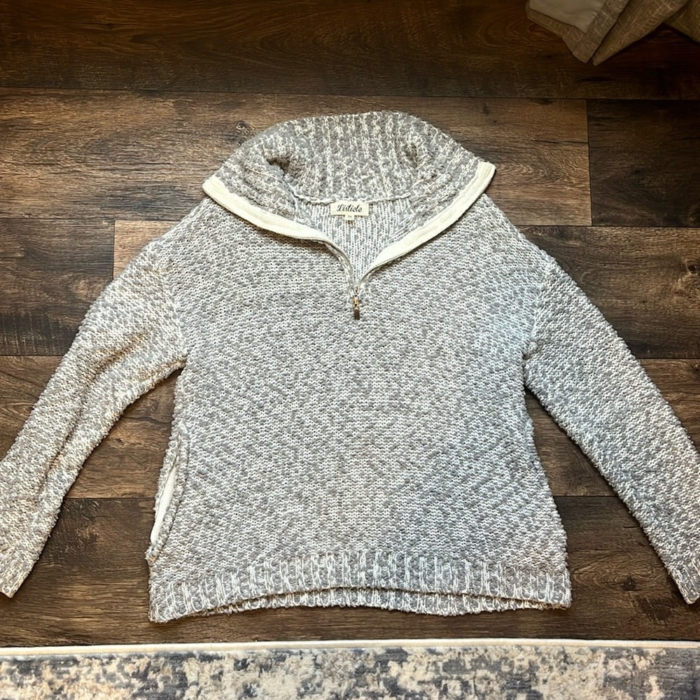 Grey and white sweater (listicle)